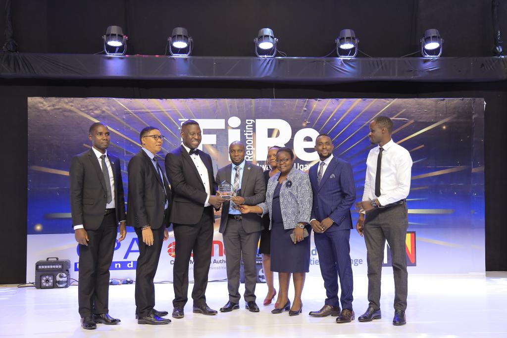 Centenary Rural Development Group Limited representatives posing for a photograph with their award of Winner in financial reporting under the Banking Services – Domestic Systemically Important Banks category at the 2024 Financial Reporting (FiRe) awards.