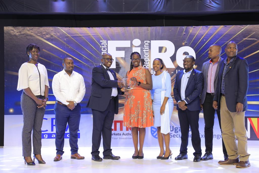 Infectious Diseases Institute representatives posing for a photograph with their award of Winner in financial reporting under the non-for profit organisations category at the 2024 Financial Reporting (FiRe) awards.