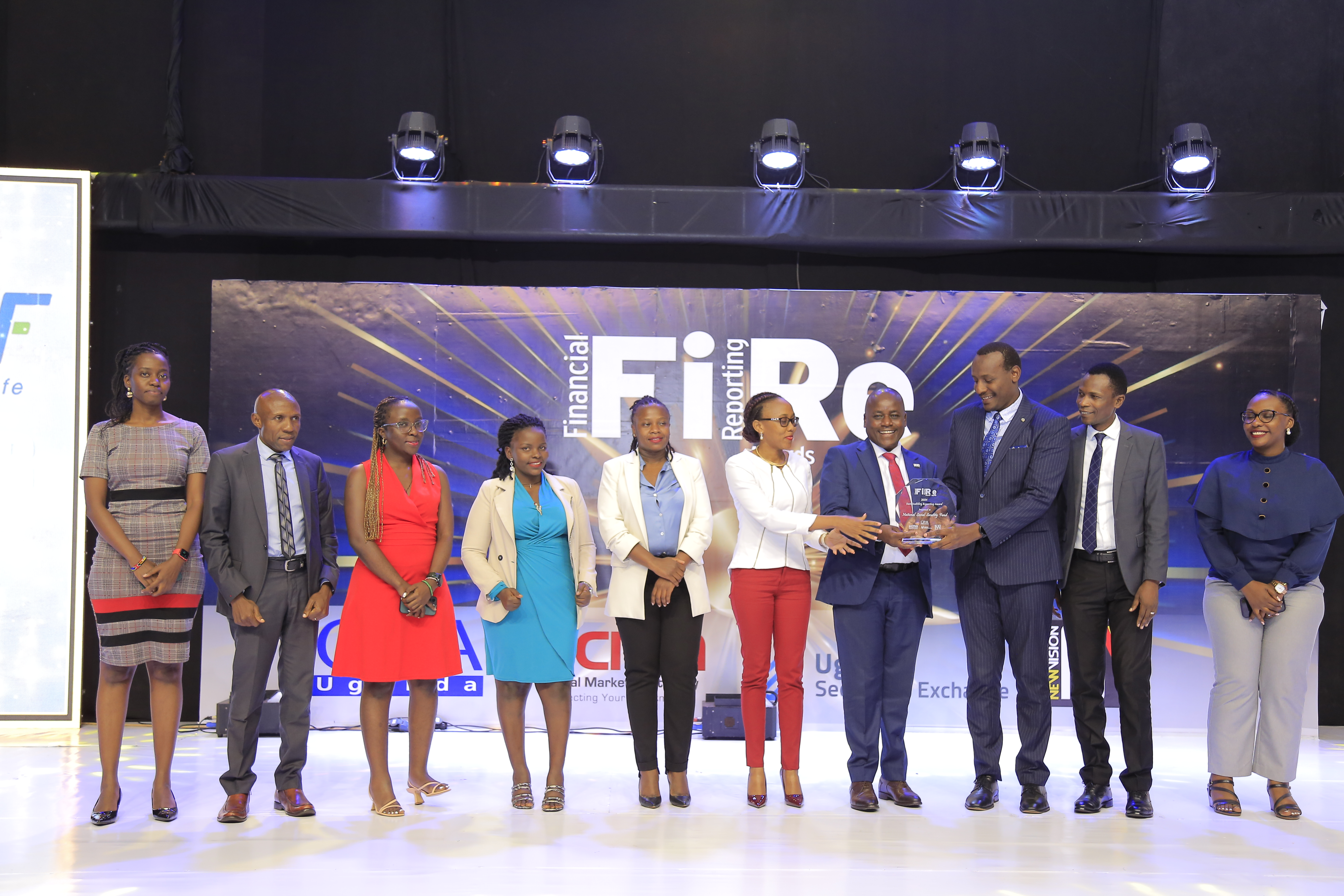 National Social Security Fund representatives posing for a photograph with their award of Winner in financial reporting under the sustainability reporting award category at the 2024 Financial Reporting (FiRe) awards.