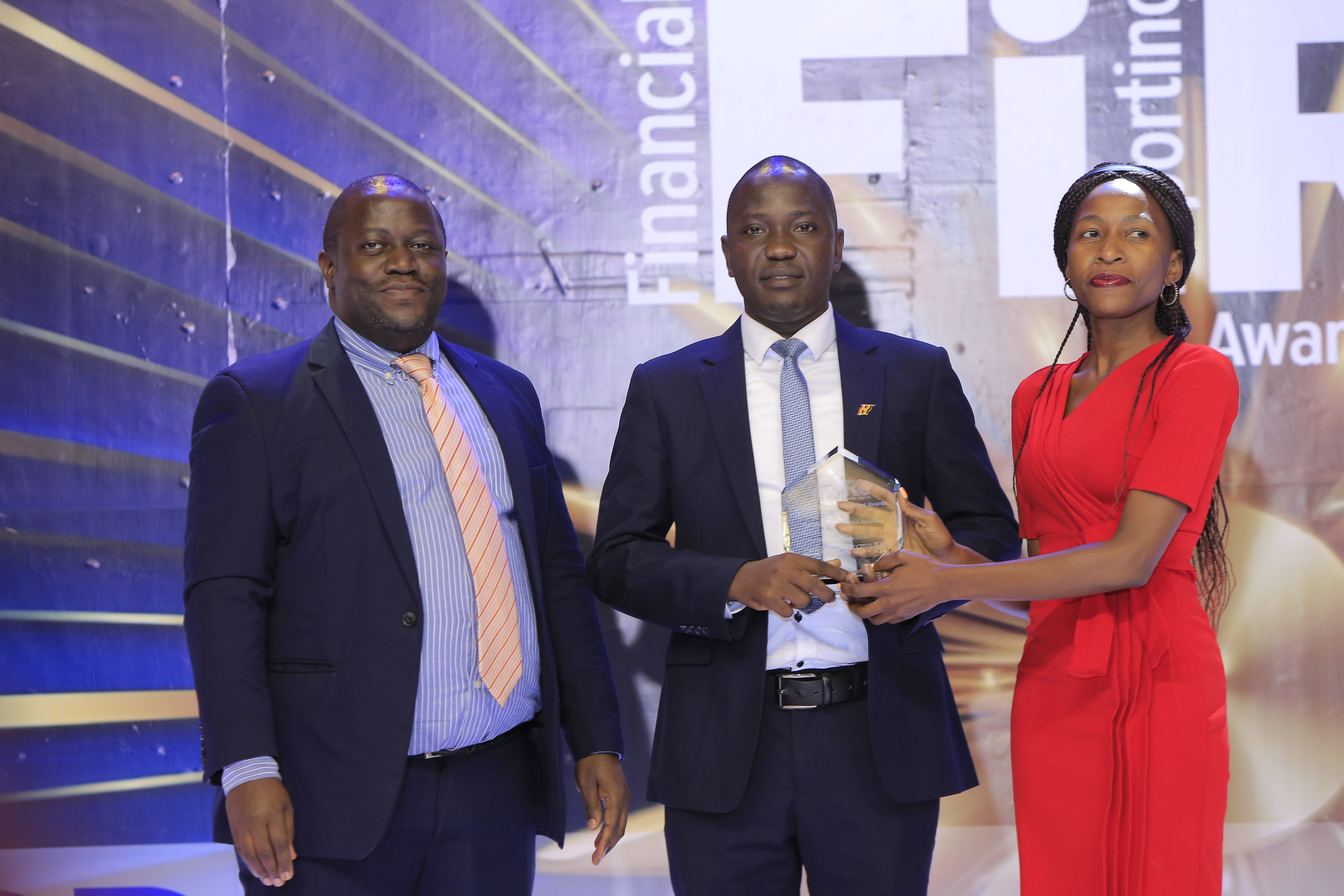 Steadfin Uganda SACCO representatives posing for a photograph with their award of Winner for achievement in financial reporting under the cooperative societies category at the 2024 Financial Reporting (FiRe) awards ceremony held at Serena Hotel Kampala on 6 November 2024.