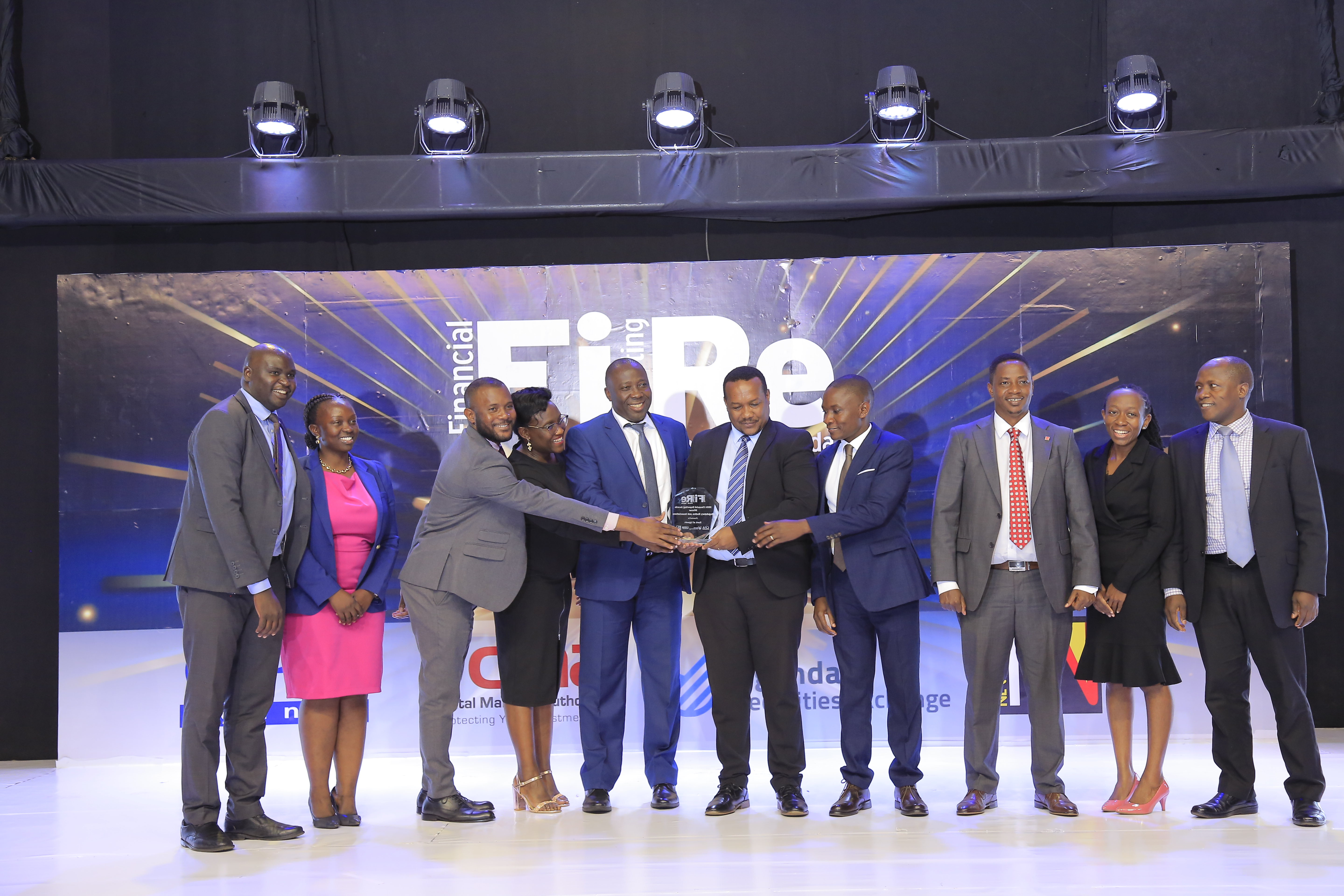 Bank of Uganda representatives posing for a photograph with their award of winner in financial reporting under the regulatory bodies and associations category at the 2024 Financial Reporting (FiRe) awards.