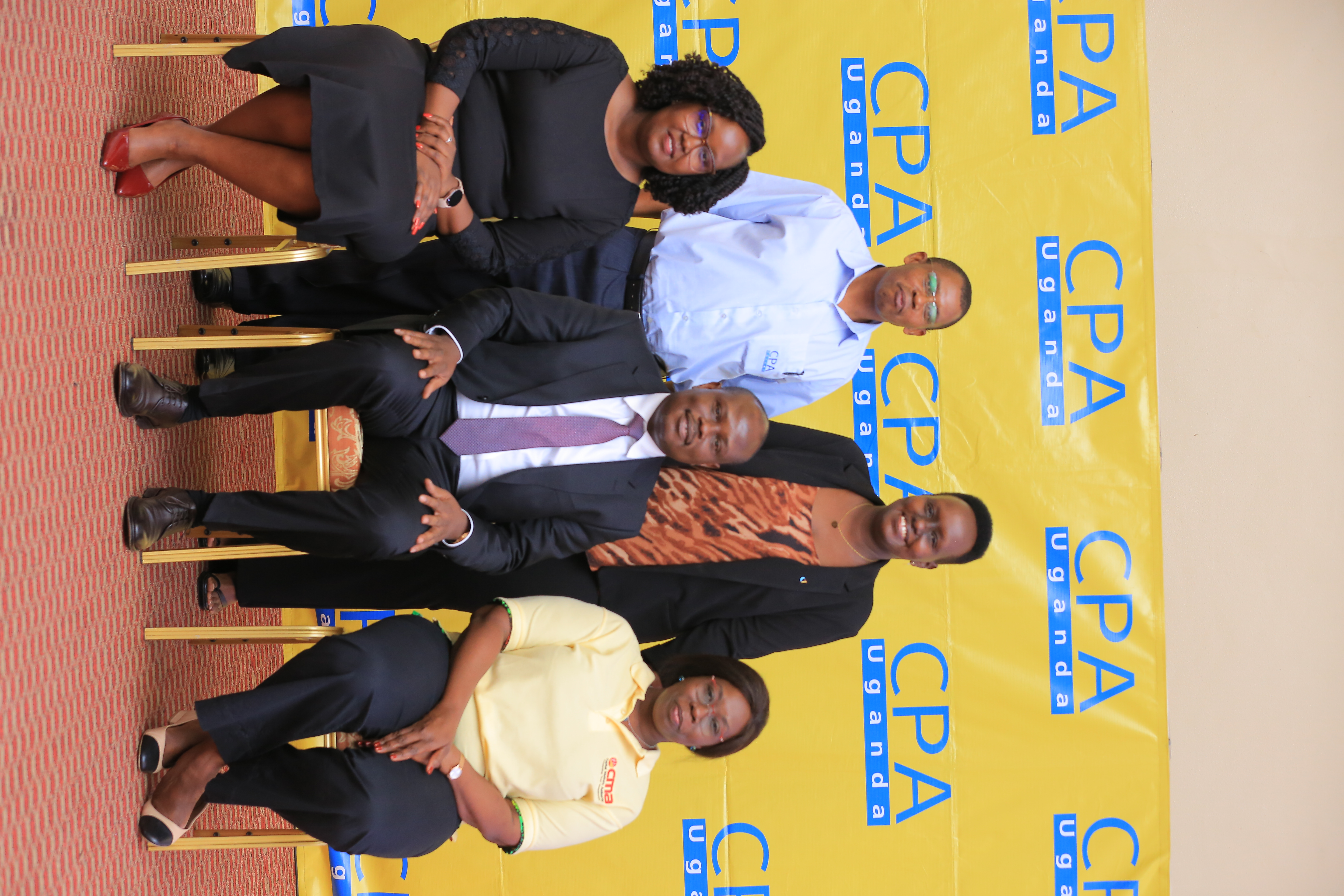 Picture Moment: CPA Edward Akol, Auditor General Uganda (C) posing with (L-R) CPA Derick Nkajja (L), CEO/Secretary and CPA Edwina Karugire, Petroleum Authority Uganda(R). Seated are, Primera Muthon, Manager Product and Business Development Centenary Technology Services (L) and CPA Josephine Okui Ossiya, President ICPAU.