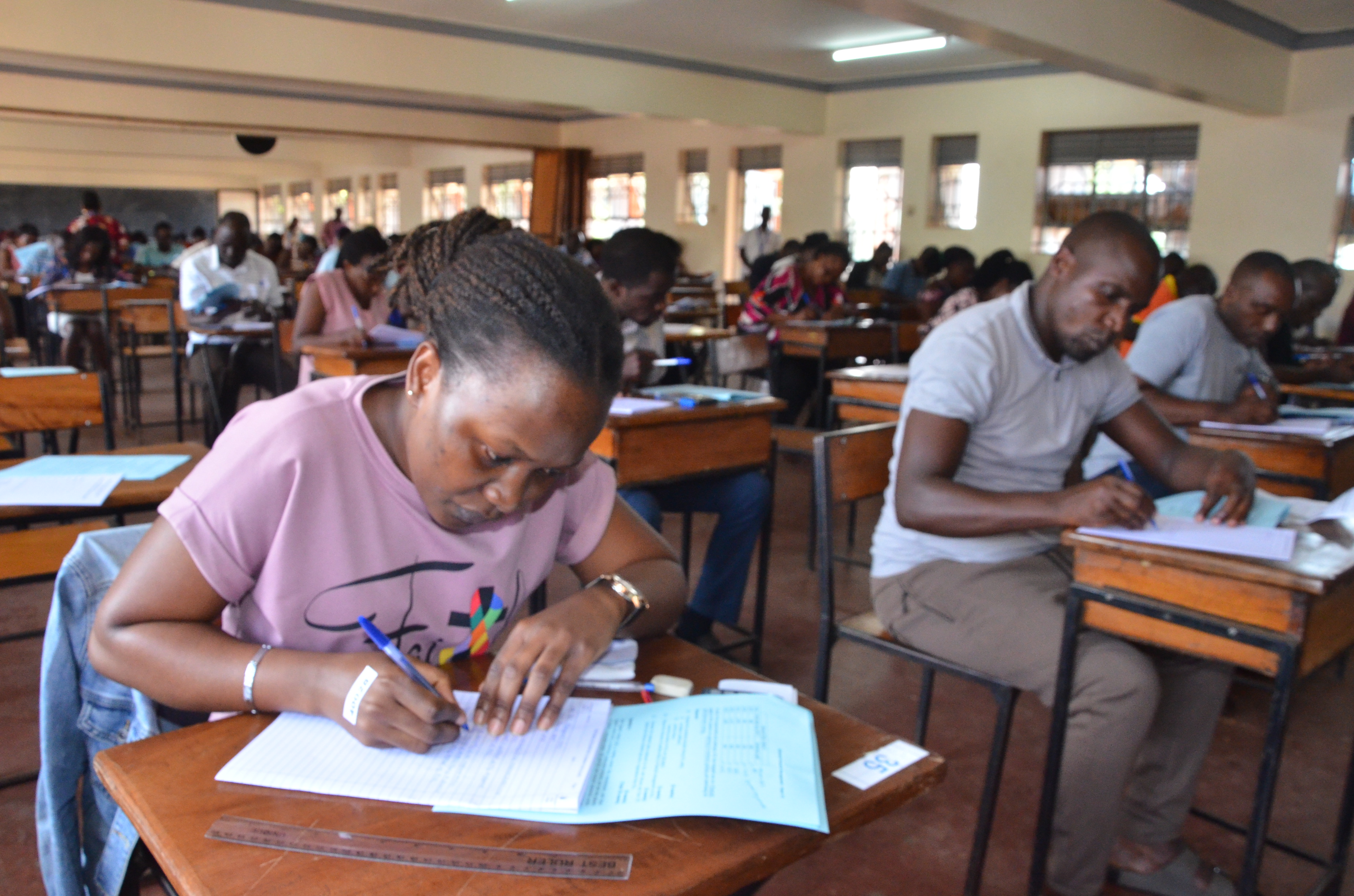 A cross section of some students writing their examinations at the Kampala centre.