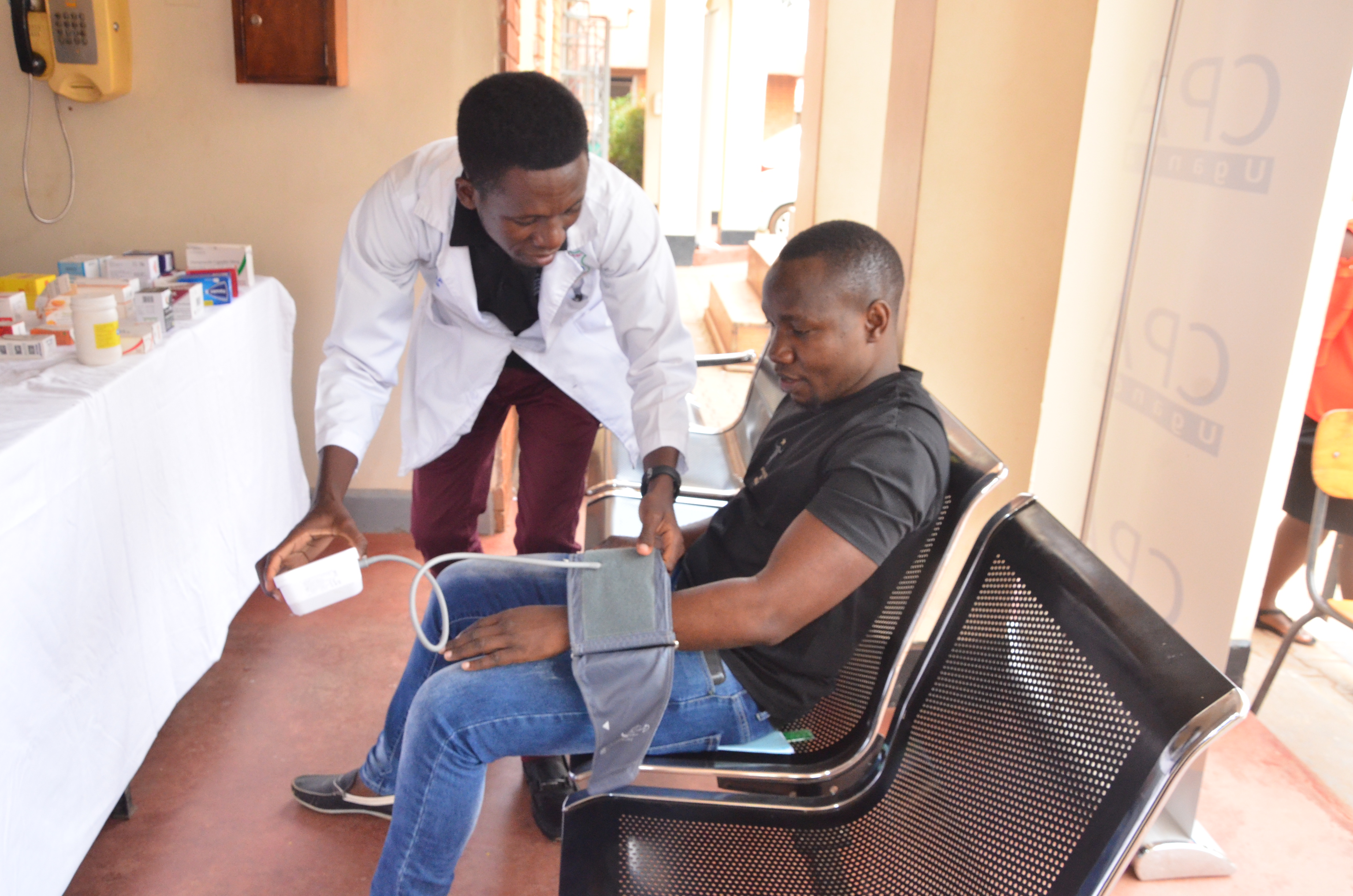 A nurse from St John Ambulance attending to a student at the Kampala examinations centre.