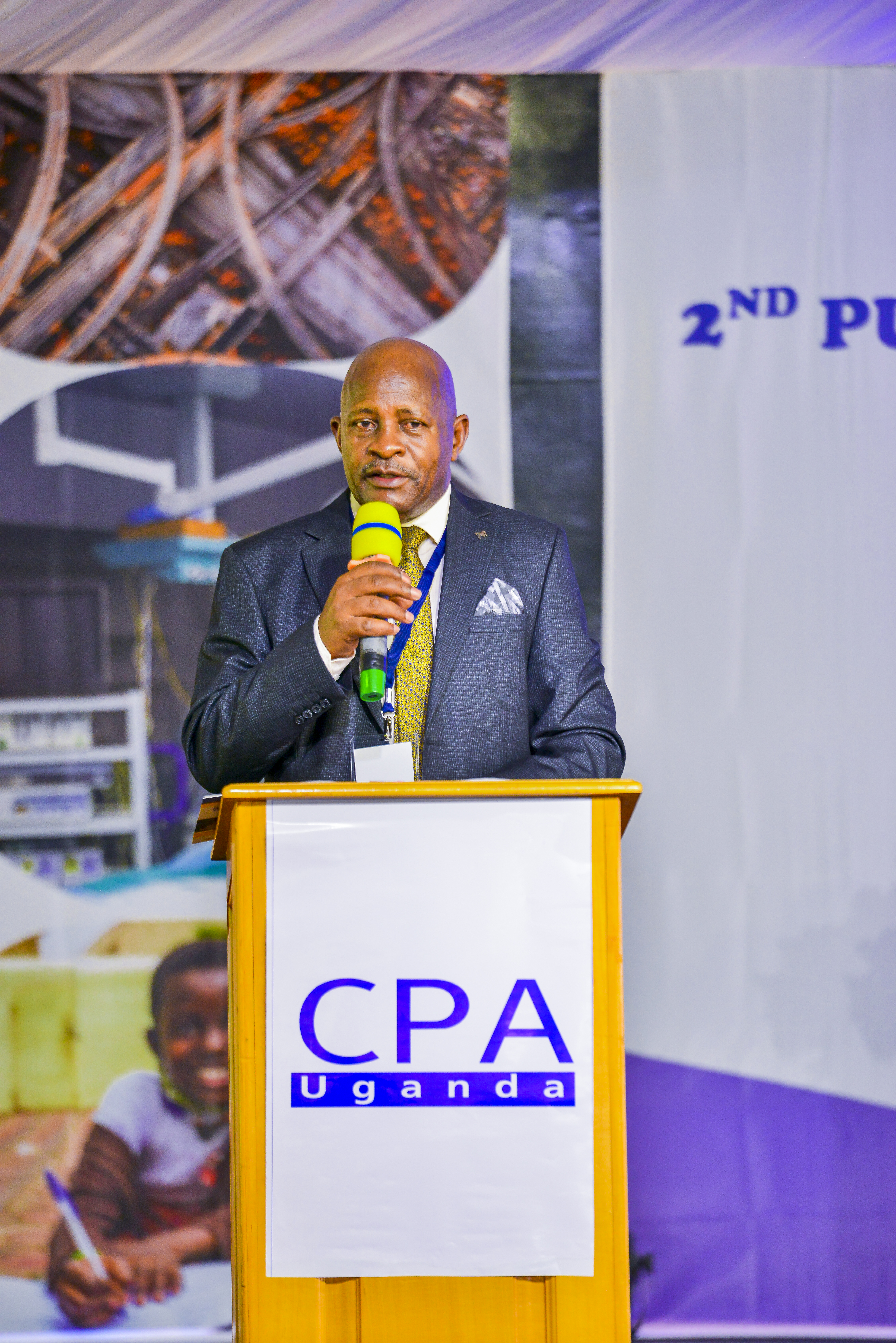 CPA David Bunnya Sserebe, Chairperson Events Management Committee giving remarks at the opening ceremony.