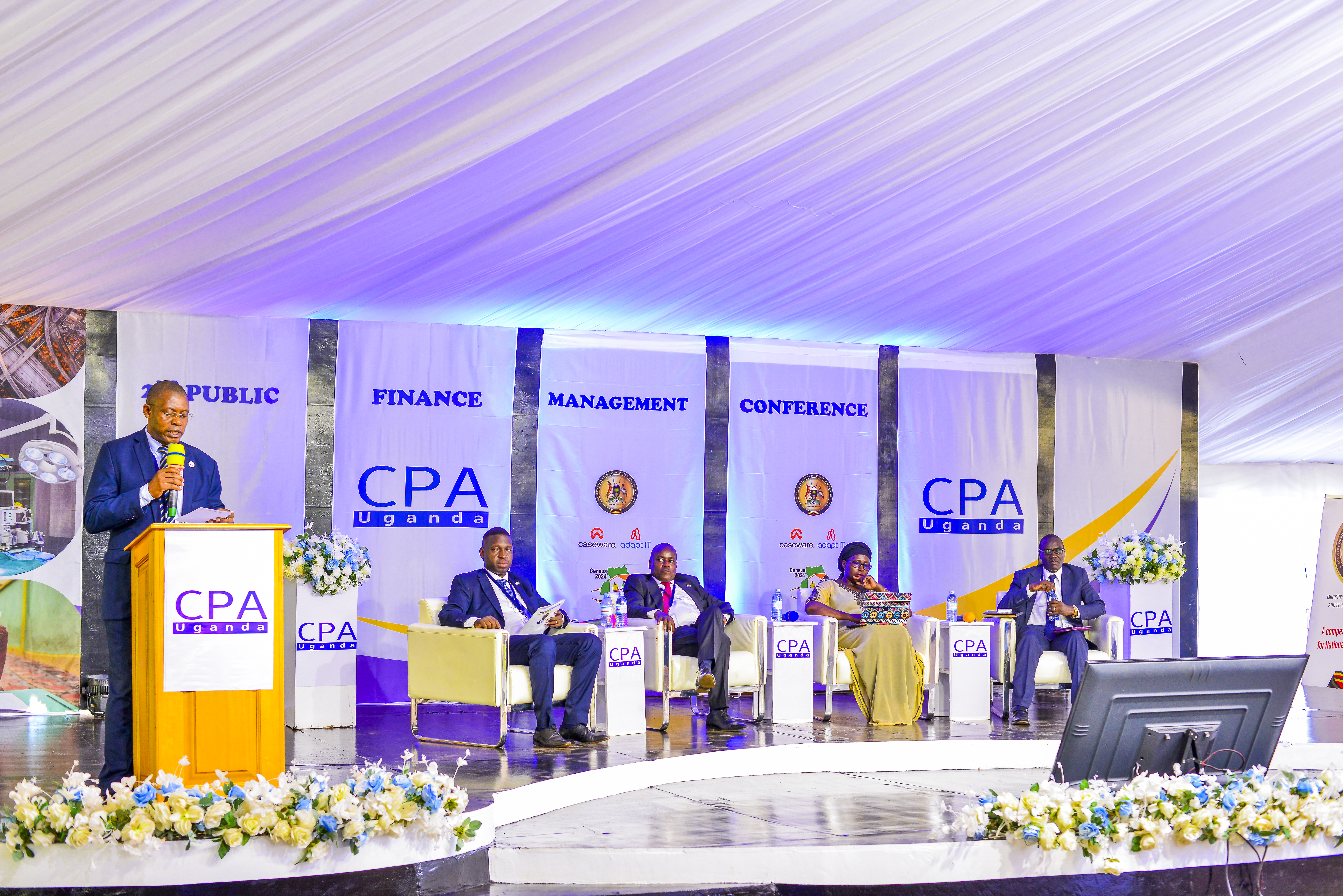 The panel at the opening ceremony of the 2nd PFM Conference. (L-R) CPA Derick Nkajja - ICPAU Council Secretary/ CEO (speaking), CPA Timothy Ediomu - ICPAU Council member, CPA Ronald Mutumba - ICPAU Vice President, CPA Keto Kayemba - PAFA President, with Prof. Vincent Bagire, the keynote speaker.