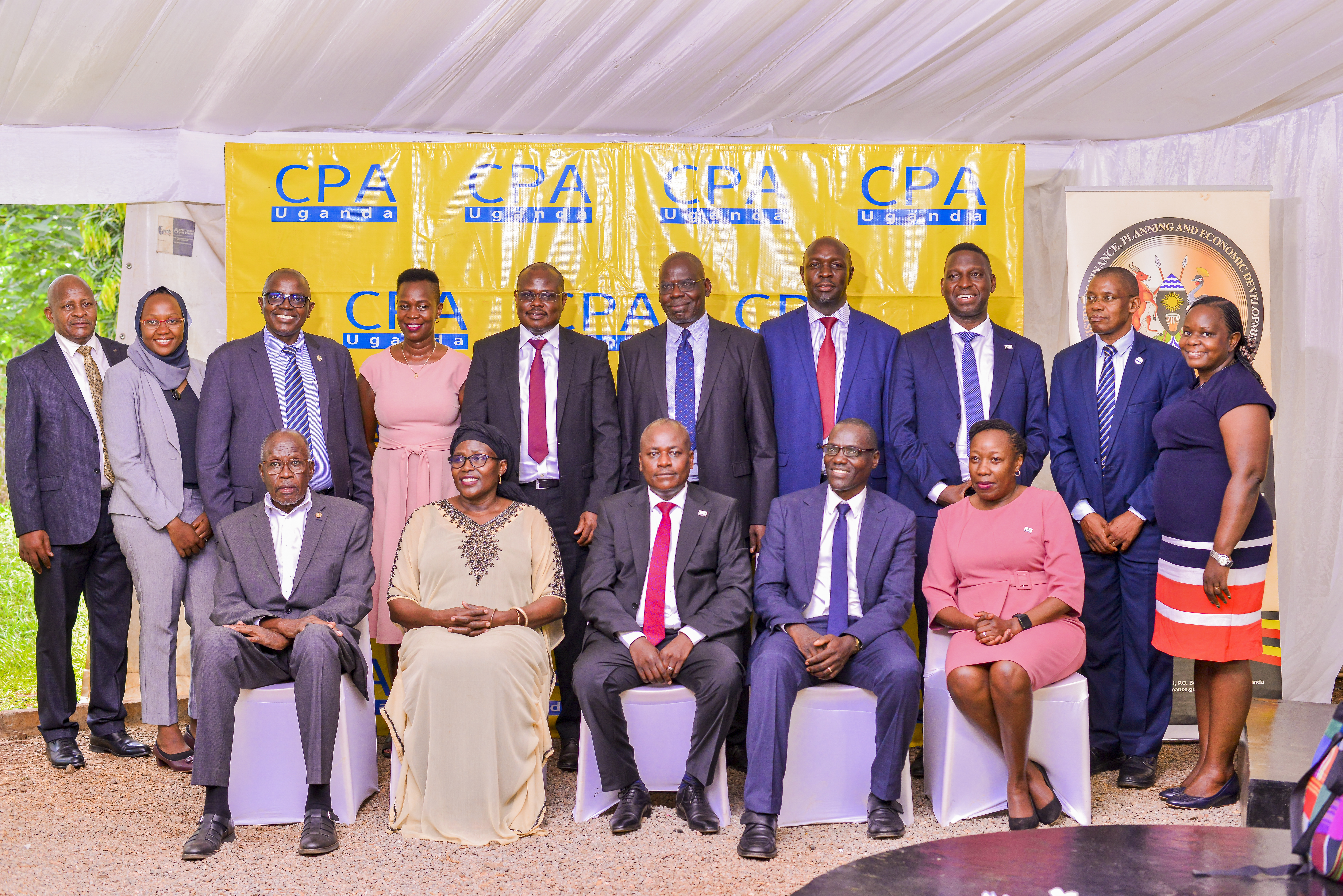 L-R seated CPA George Egaddu - ICPAU 1st President, CPA Keto Kayemba - PAFA President, CPA Ronald Mutumba - ICPAU Vice President, Prof. Vincent Bagire - Keynote speaker, CPA Laura Orobia ICPAU Council member with other ICPAU Council members and the Events Committee. Standing (3rd L) is 9th ICPAU President, CPA Constant Mayende.